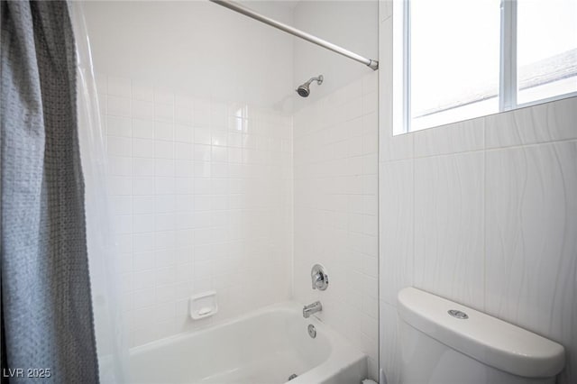 bathroom with toilet and shower / bathtub combination with curtain