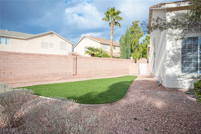 view of yard featuring a fenced backyard