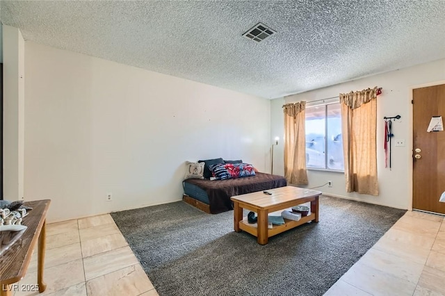 living room featuring visible vents and a textured ceiling