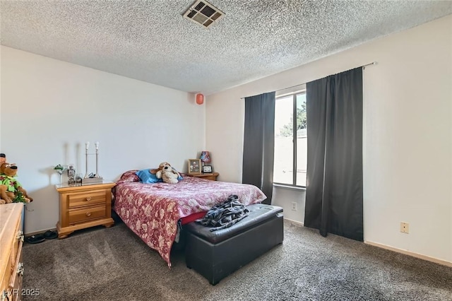 carpeted bedroom with visible vents, a textured ceiling, and baseboards