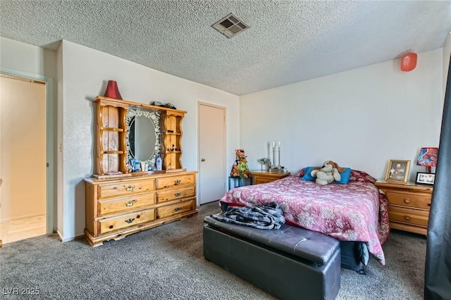 bedroom with a textured ceiling, visible vents, and carpet flooring