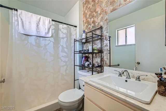 bathroom featuring vanity, toilet, and a shower with curtain