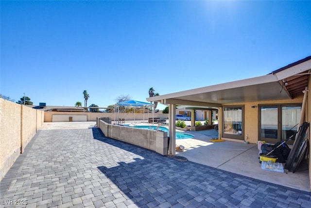 view of patio with a fenced in pool and a fenced backyard