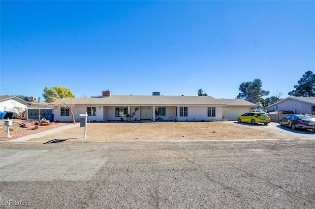 ranch-style home featuring an attached garage