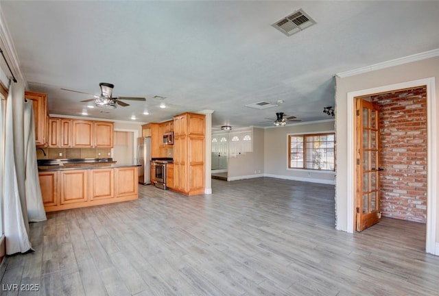 kitchen with visible vents, open floor plan, stainless steel appliances, crown molding, and light wood-style floors