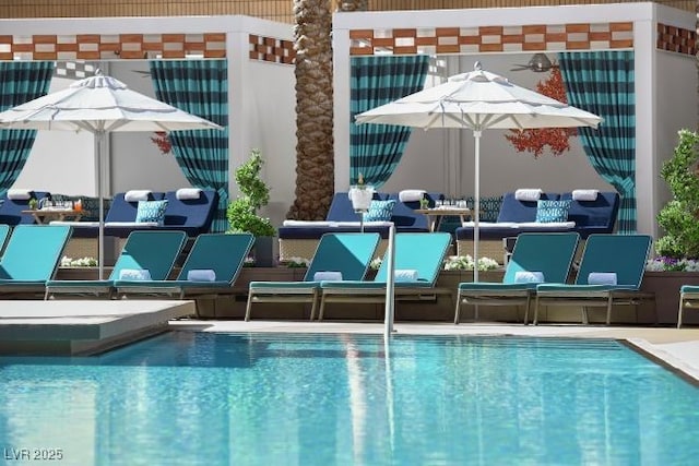 3750 Las Vegas Blvd Unit 2711, Las Vegas, NV 89158 - community pool with outdoor lounge area and a patio