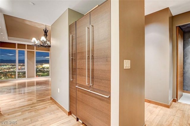 3750 Las Vegas Blvd Unit 2711, Las Vegas, NV 89158 - corridor with a chandelier and light wood-style floors