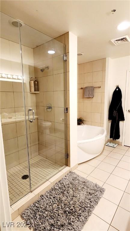 full bath with a garden tub, visible vents, a stall shower, and tile patterned floors