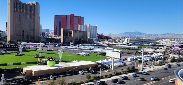 property's view of city featuring a mountain view