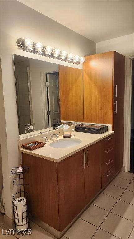 bathroom with tile patterned flooring and vanity