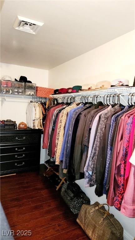 spacious closet with wood finished floors and visible vents