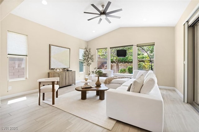 living area featuring baseboards, a ceiling fan, vaulted ceiling, light wood-style floors, and recessed lighting