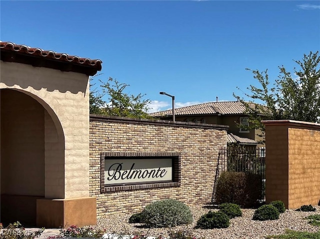 community sign with an attached garage