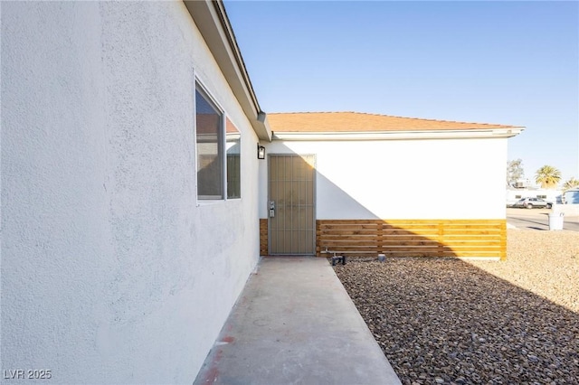 view of side of property featuring stucco siding