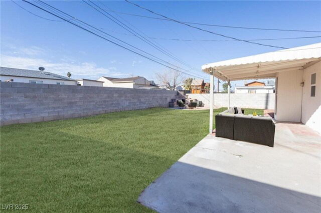 view of yard with a patio area, an outdoor living space, and a fenced backyard