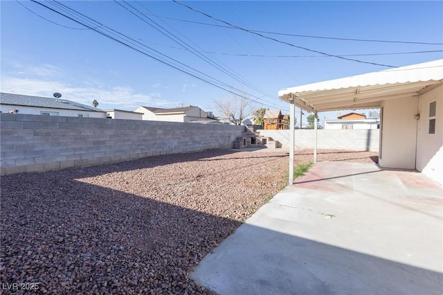 view of yard featuring a fenced backyard and a patio area