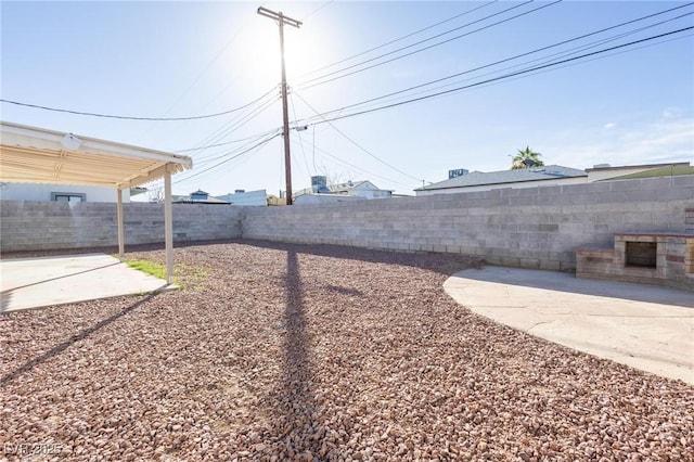 view of yard with a patio and a fenced backyard