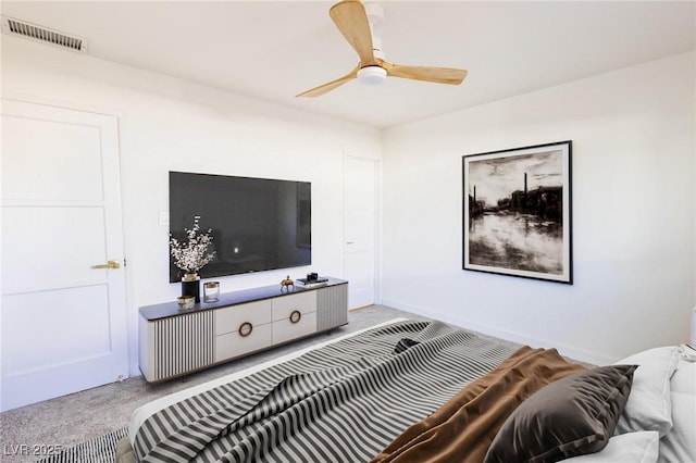 carpeted bedroom with baseboards, visible vents, and ceiling fan