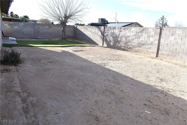 view of yard with a fenced backyard