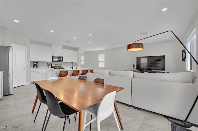 dining space with recessed lighting and visible vents