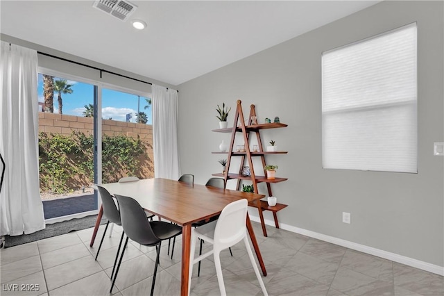 dining room featuring baseboards and visible vents