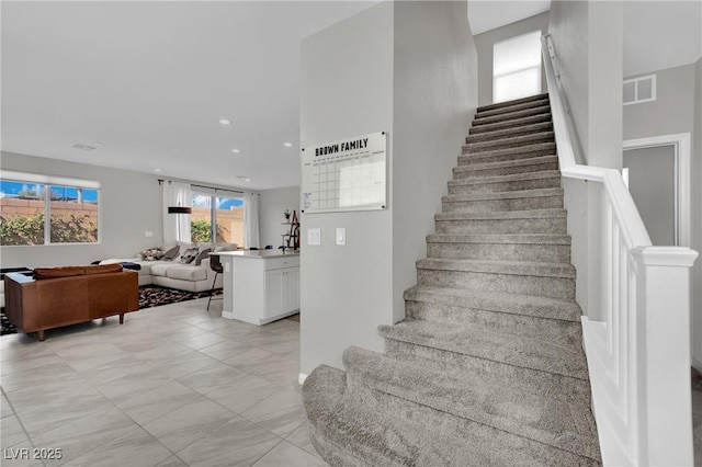 stairs featuring visible vents and recessed lighting