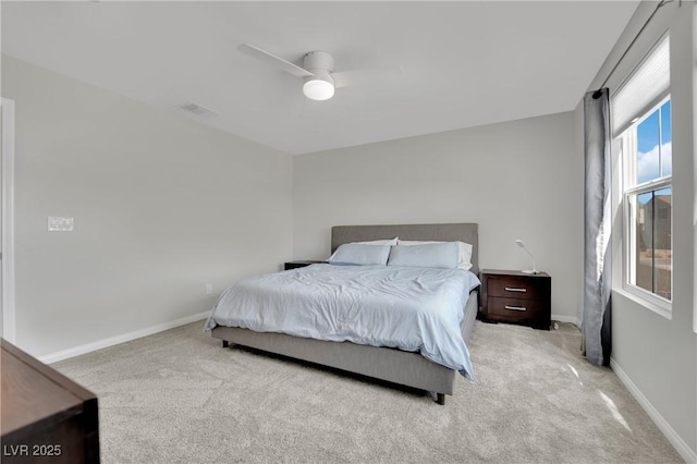 bedroom featuring carpet flooring, visible vents, a ceiling fan, and baseboards