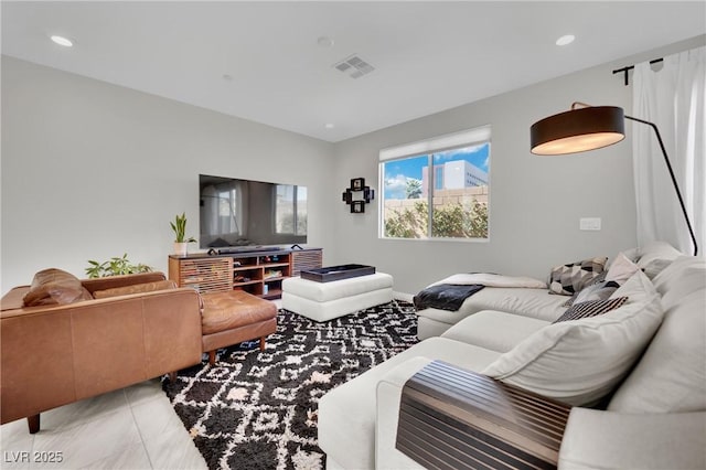 living room with recessed lighting and visible vents