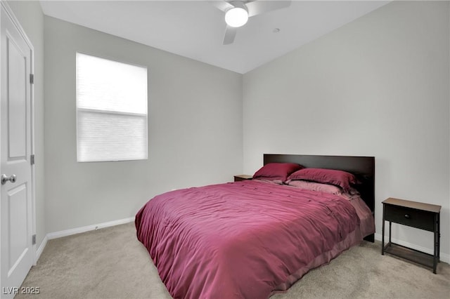 carpeted bedroom featuring baseboards and a ceiling fan