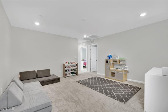 living room with carpet flooring, recessed lighting, and baseboards