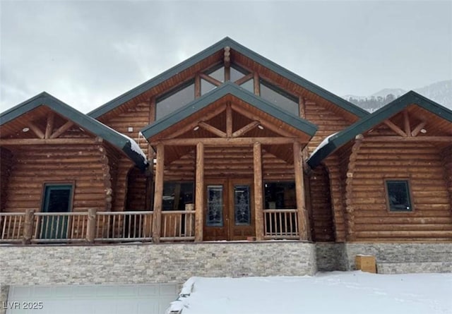 view of front of house with log siding