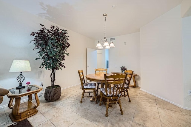 dining room featuring a notable chandelier, light tile patterned flooring, visible vents, and baseboards