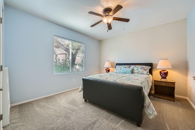 carpeted bedroom featuring ceiling fan and baseboards