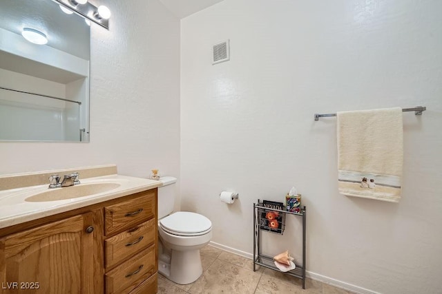 bathroom featuring visible vents, baseboards, toilet, tile patterned flooring, and vanity