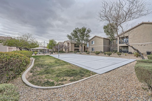 view of sport court with a residential view