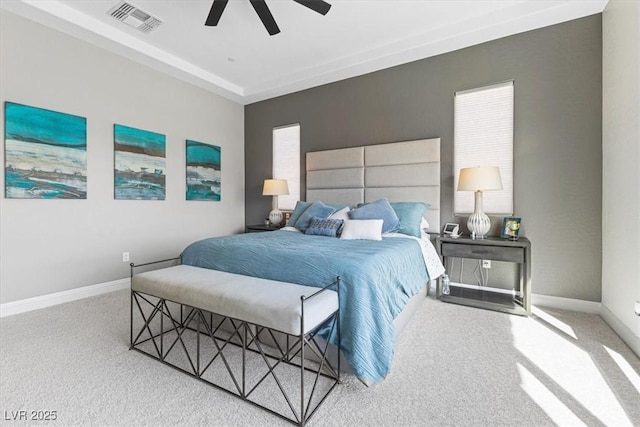 carpeted bedroom featuring baseboards, visible vents, and a ceiling fan