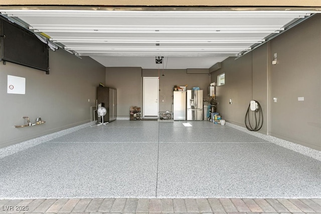 garage with fridge and stainless steel fridge