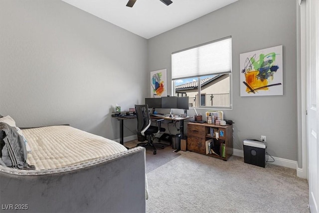 carpeted bedroom with ceiling fan and baseboards