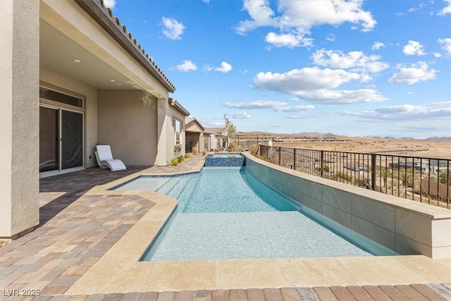 view of pool with a patio area, a fenced backyard, and a pool with connected hot tub