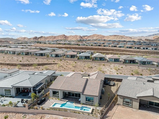 drone / aerial view with a residential view and a mountain view