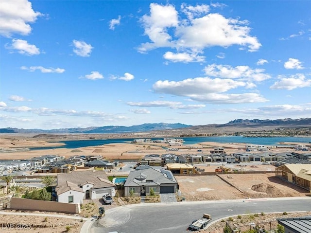 drone / aerial view featuring a residential view and a mountain view