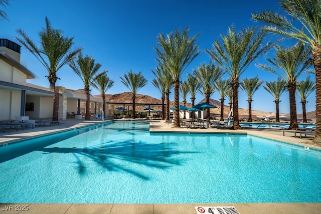 community pool with a patio area