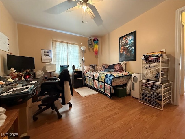 bedroom with ceiling fan and wood finished floors