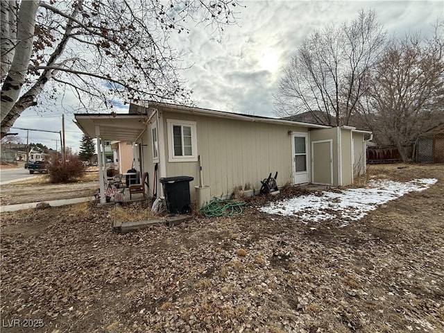 view of home's exterior with fence