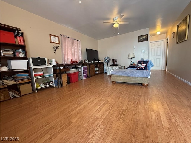 bedroom with ceiling fan and wood finished floors