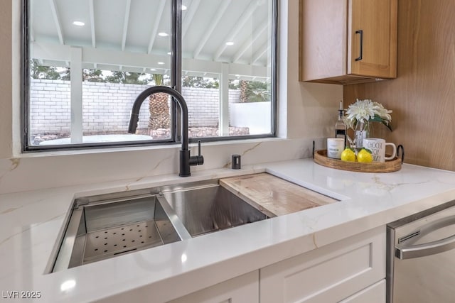 details featuring a sink and stainless steel dishwasher