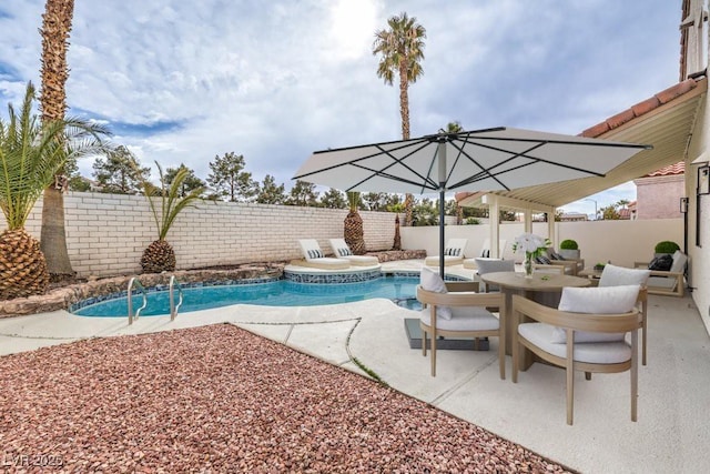 view of pool featuring outdoor dining space, a patio area, a fenced backyard, and a fenced in pool