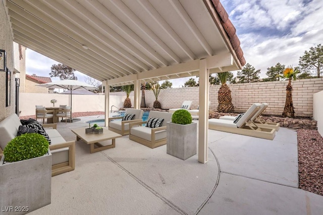 view of patio / terrace with outdoor dining area, a fenced backyard, and outdoor lounge area