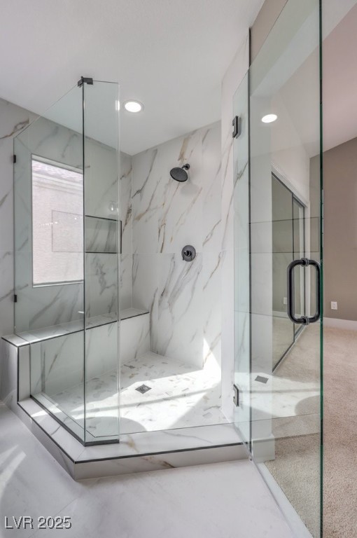 bathroom with recessed lighting and a marble finish shower