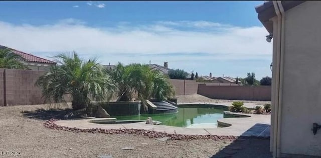 view of pool with a fenced in pool, a patio area, and a fenced backyard